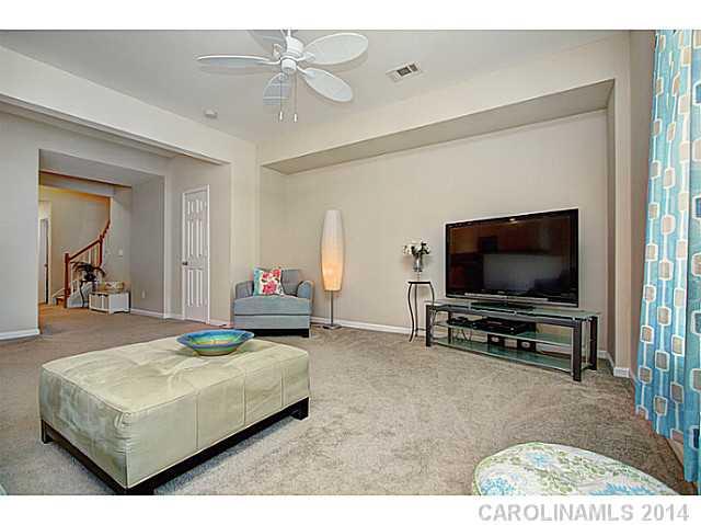 146 Council House Road, Unit 168 Fort Mill, SC 29708 - Photo 4 of 16 a bedroom with a bed and a flat screen tv
