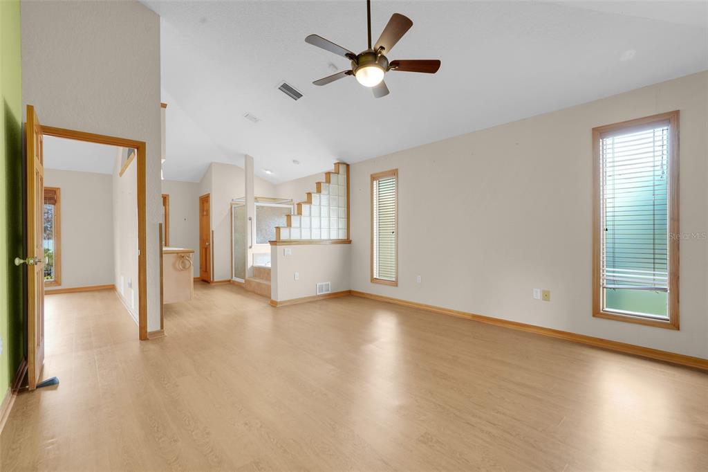1207 Overlook Road Eustis, FL 32726 - Photo 18 of 44 a view of livingroom with hardwood floor and a ceiling fan
