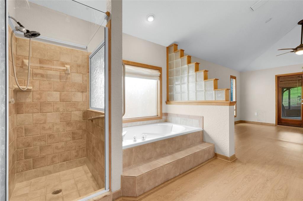 1207 Overlook Road Eustis, FL 32726 - Photo 20 of 44 a spacious bathroom with a tub and shower