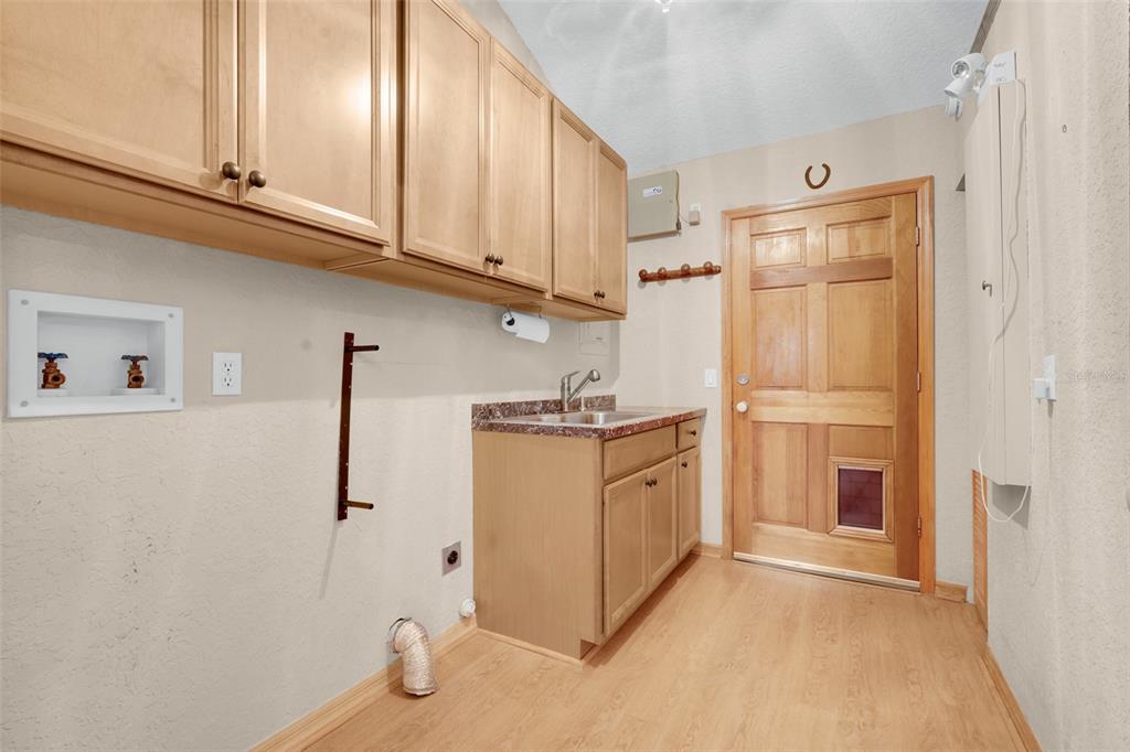 1207 Overlook Road Eustis, FL 32726 - Photo 29 of 44 a kitchen with stainless steel appliances granite countertop a refrigerator and a stove