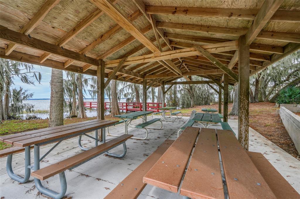 1207 Overlook Road Eustis, FL 32726 - Photo 41 of 44 a view of a patio with a table and chairs
