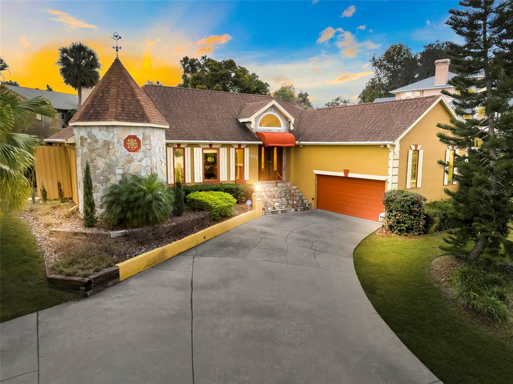 1207 Overlook Road Eustis, FL 32726 - Photo 44 of 44 a front view of a house with garden
