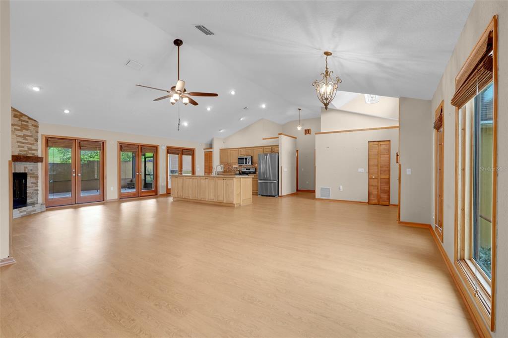 1207 Overlook Road Eustis, FL 32726 - Photo 7 of 44 a view of a livingroom with furniture wooden floor and a ceiling fan