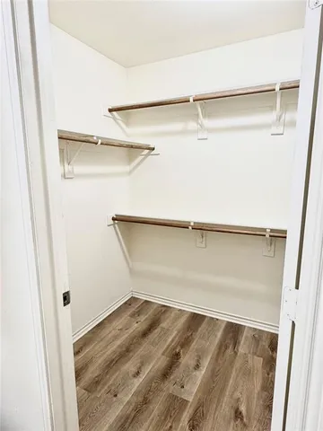 a view of an empty walk in closet
