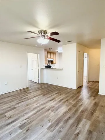 a view of a kitchen with a sink and a kitchen counter top space