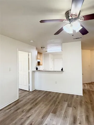 a view of a kitchen with a sink and cabinets