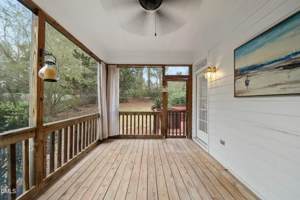 a view of wooden floor in a room next to a window