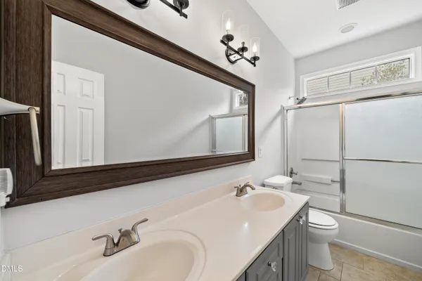 a view of backyard with large trees