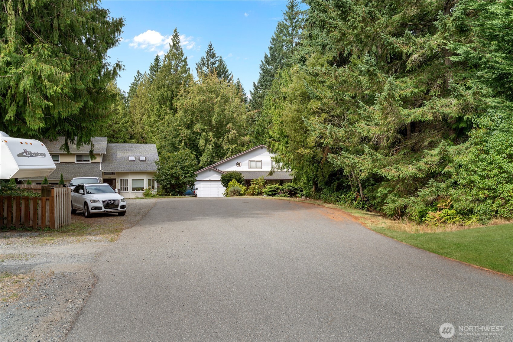 4105 Tartan Way Clinton, WA 98236 - Photo 13 of 18 a view of a city street with parked cars