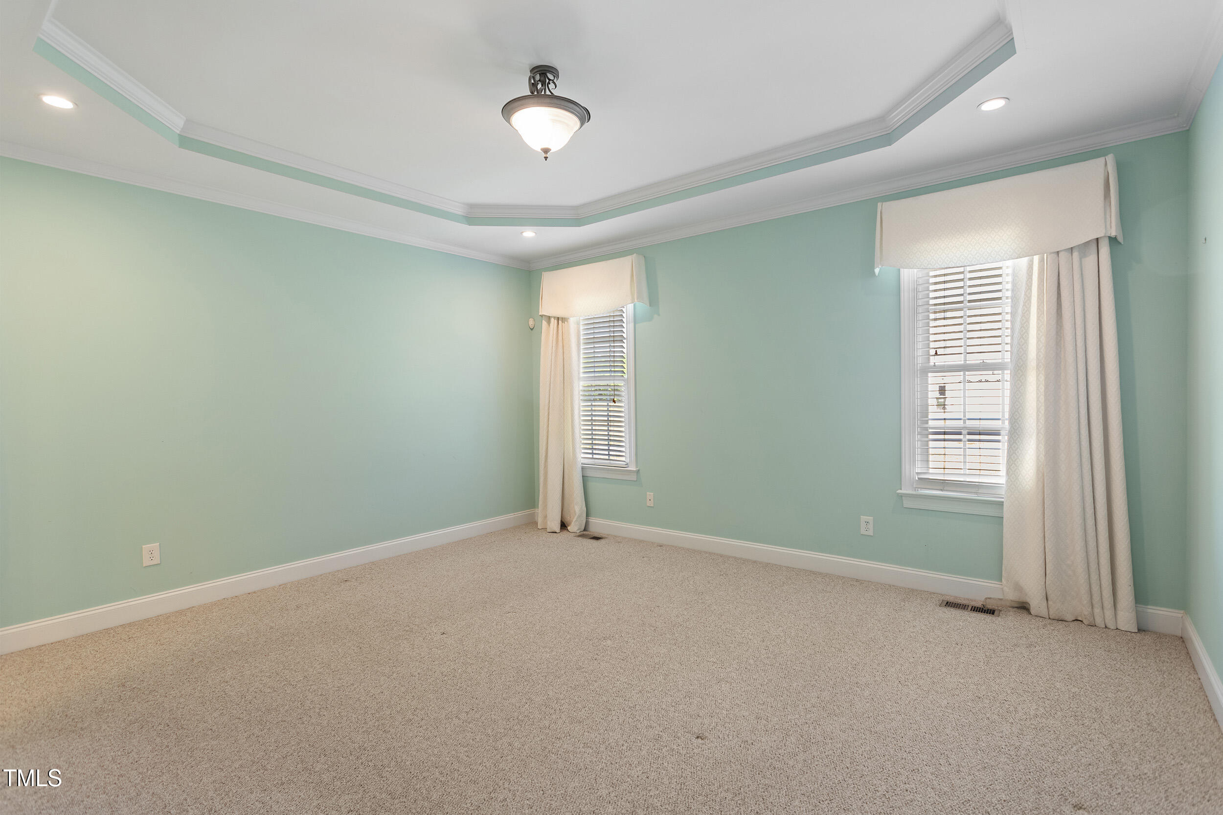97 Rand Road Raleigh, NC 27603 - Photo 14 of 34 an empty room with windows and closet