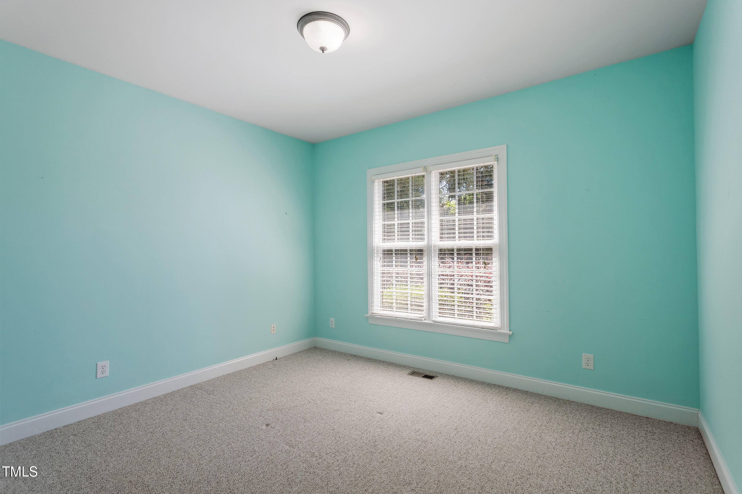 97 Rand Road Raleigh, NC 27603 - Photo 18 of 34 an empty room with a window