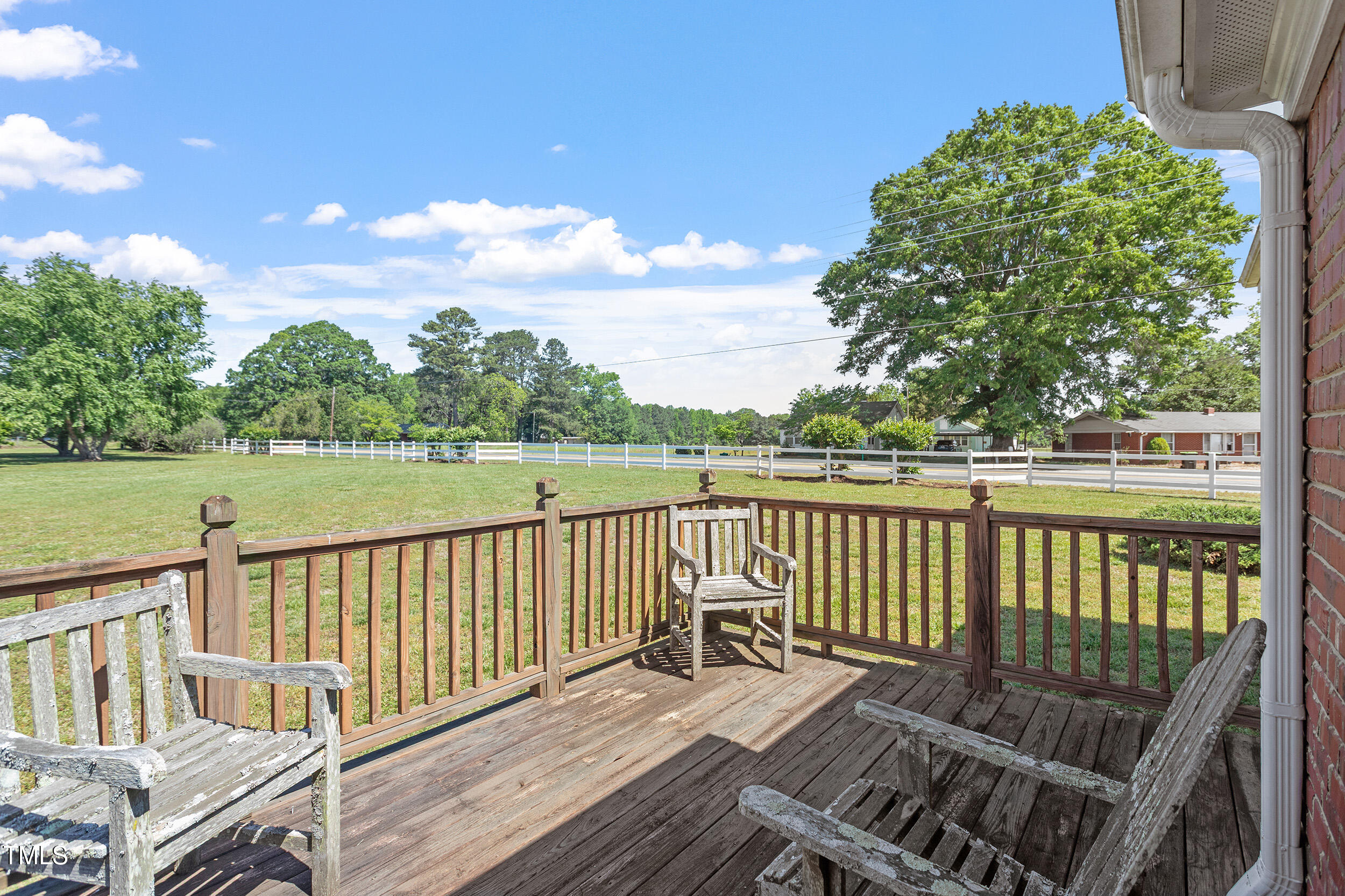 97 Rand Road Raleigh, NC 27603 - Photo 30 of 34 a view of a wooden deck with chairs