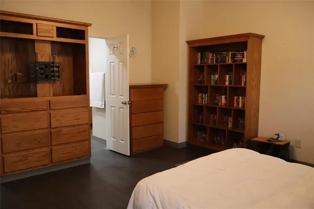 a bedroom with a bed and furniture