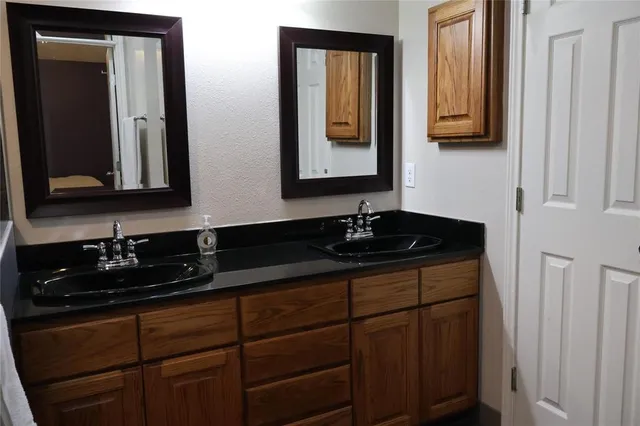 a bathroom with sink and mirror