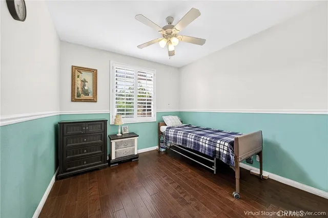 a bedroom with furniture and a window