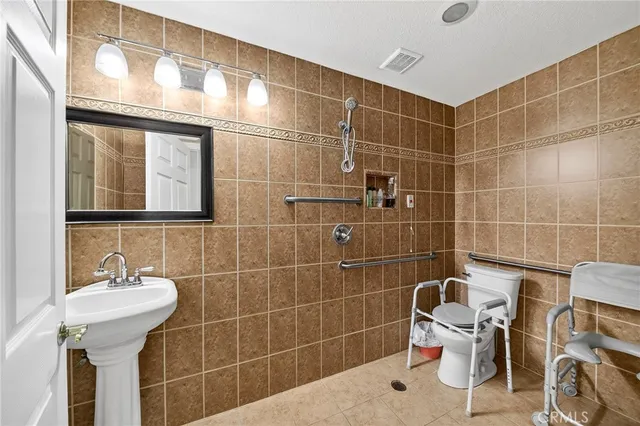 a bathroom with a sink and mirror