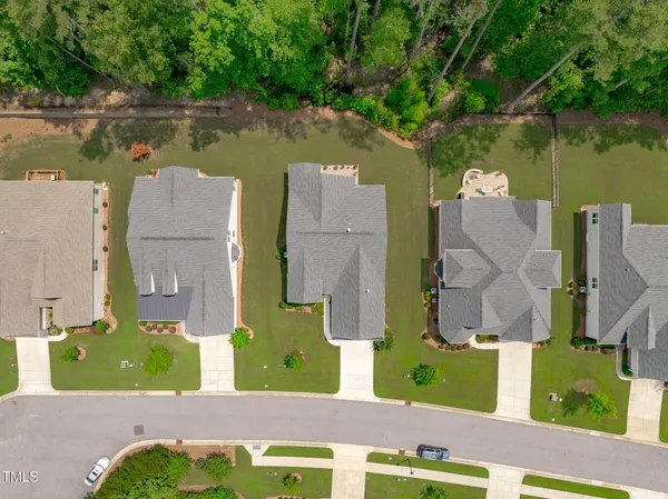 an aerial view of houses with yard