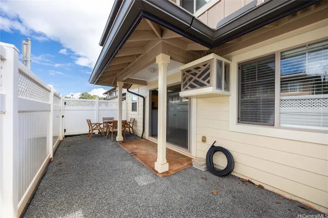 a front view of a building with lot of cars parked