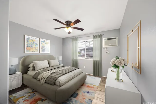 an empty room with a window and a ceiling fan