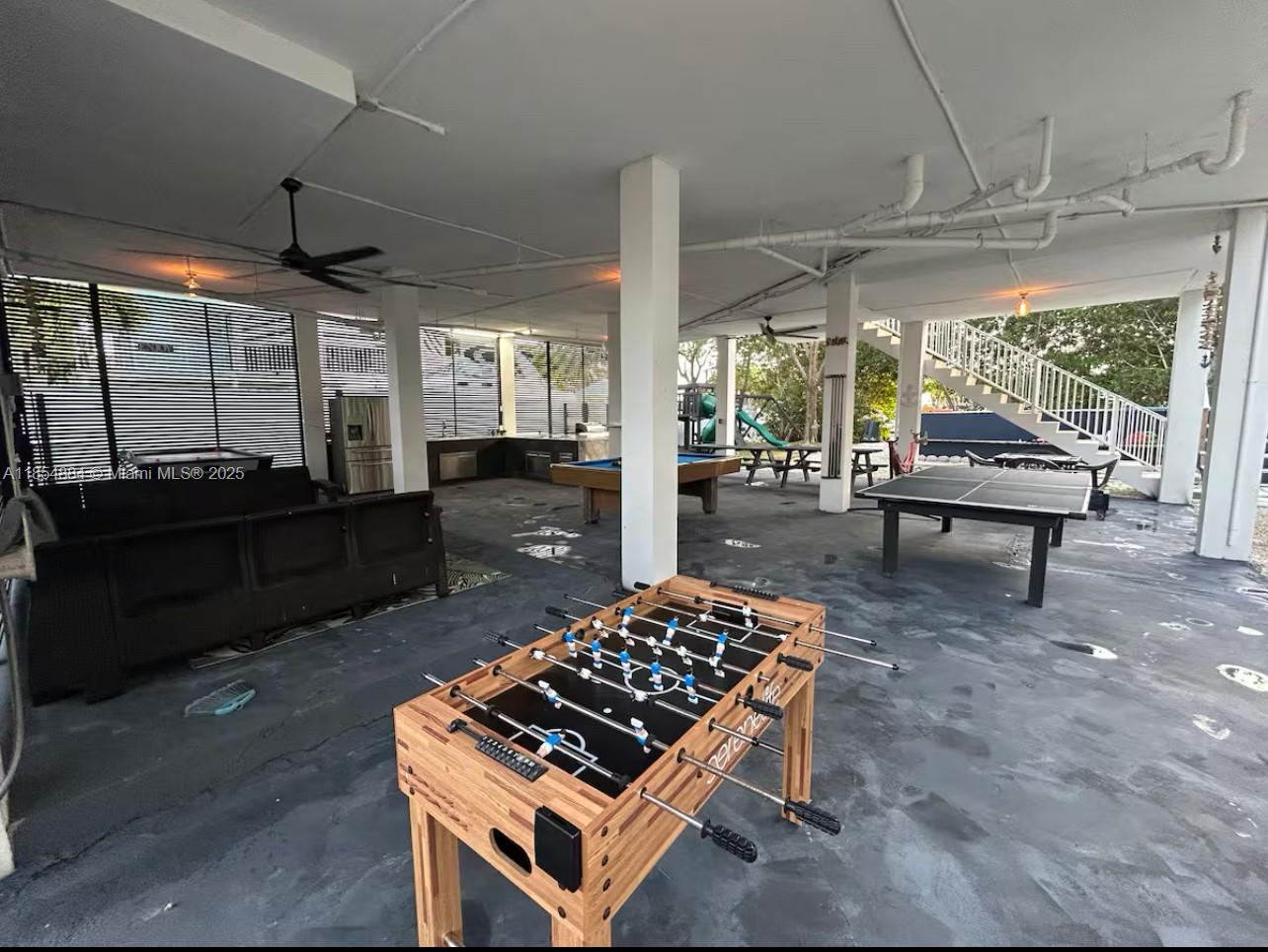 350 Hazel Street Key Largo, FL 33037 - Photo 13 of 22 a living room with patio furniture and a wooden floor