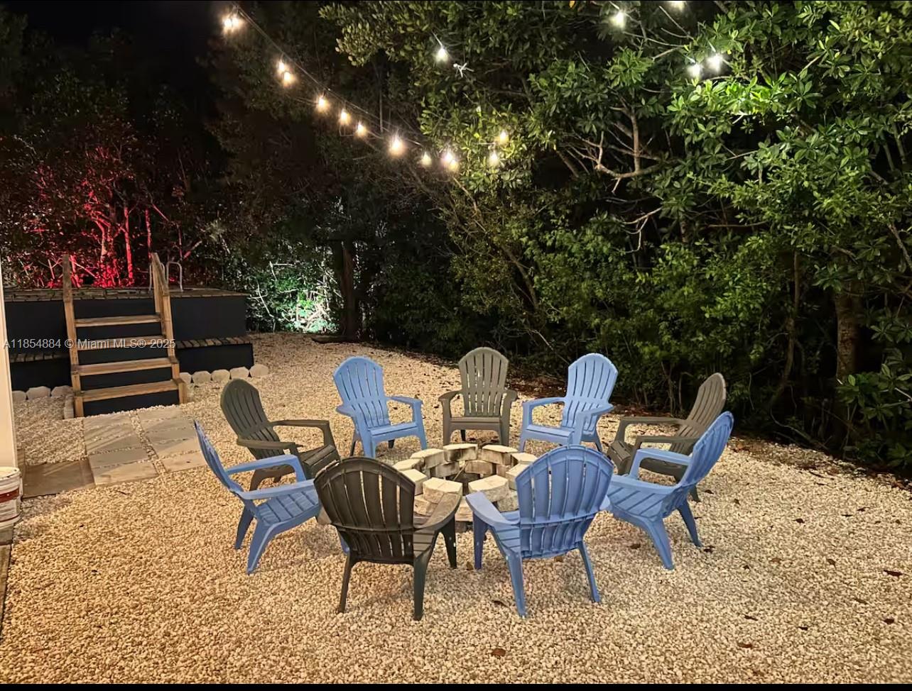 350 Hazel Street Key Largo, FL 33037 - Photo 15 of 22 a view of a chairs and tables in the patio