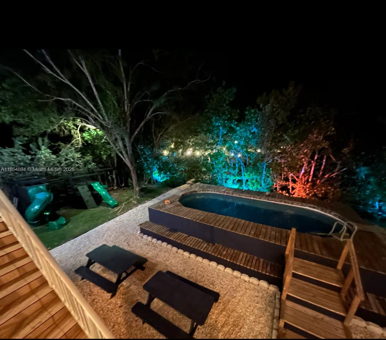 350 Hazel Street Key Largo, FL 33037 - Photo 16 of 22 a view of a bench in a backyard