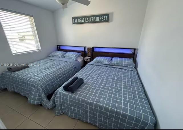 350 Hazel Street Key Largo, FL 33037 - Photo 22 of 22 a bedroom with a bed and a window