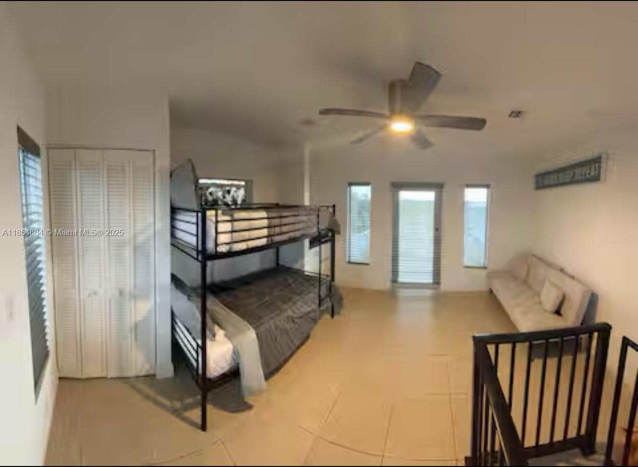 350 Hazel Street Key Largo, FL 33037 - Photo 6 of 22 a living room with furniture and a chandelier