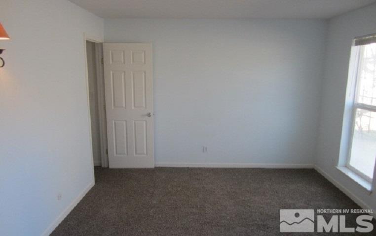 15815 Easy Street Reno, NV 89521 - Photo 9 of 13 an empty room with windows