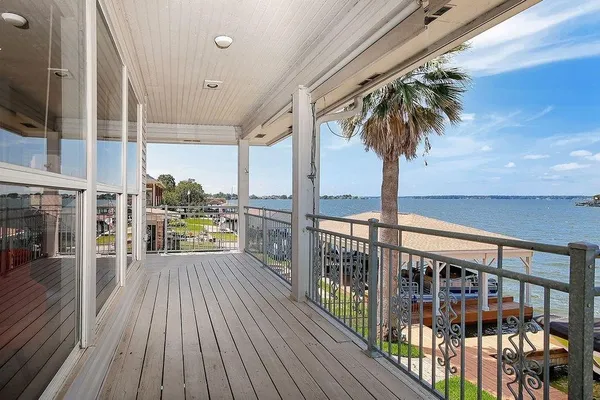 a view of a living room and a balcony