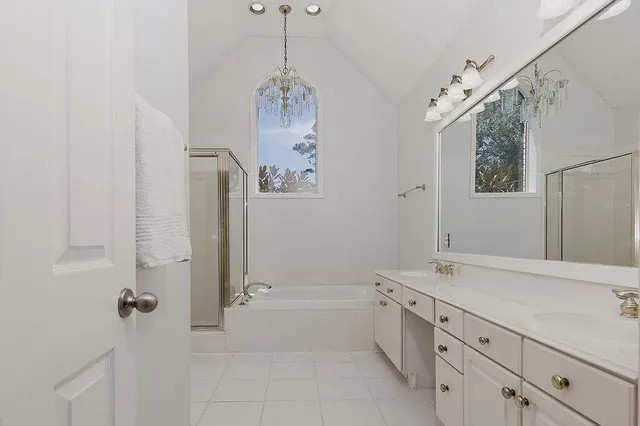 a bath room with a sink and a mirror