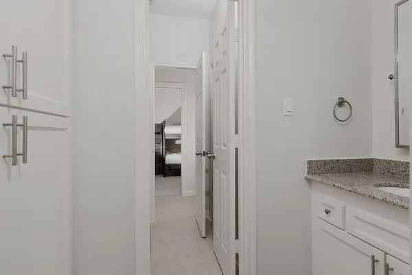 a view of a kitchen from the hallway