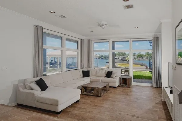 a living room with furniture and a large window