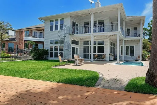 front view of a brick house with a yard