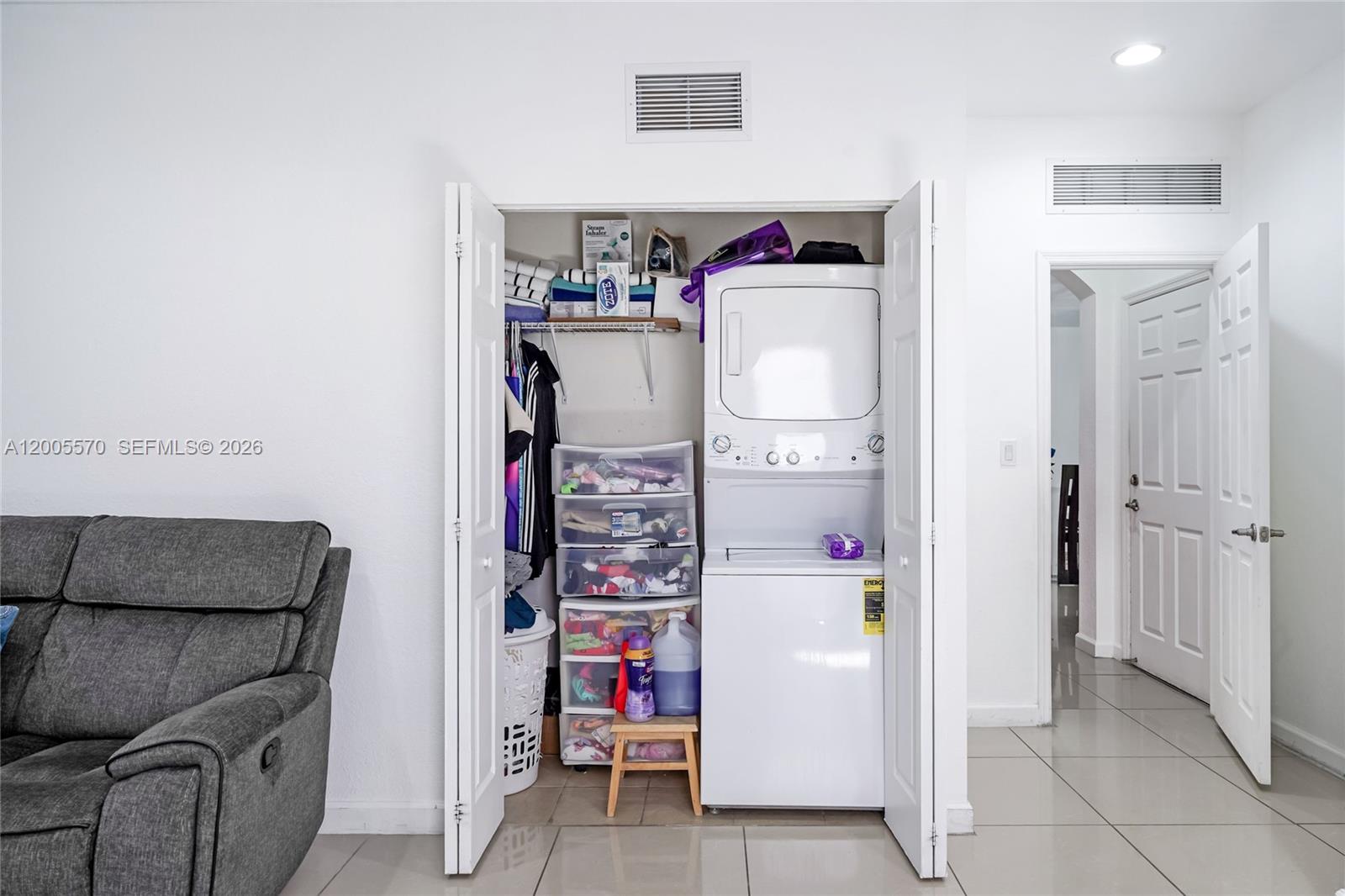 15294 Southwest 173rd Street Miami, FL 33187 - Photo 12 of 48 a storage room with washer and dryer