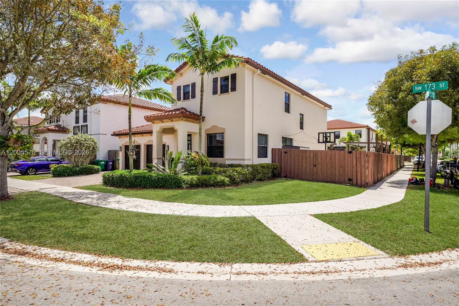 15294 Southwest 173rd Street Miami, FL 33187 - Photo 2 of 48 a front view of a house with a yard