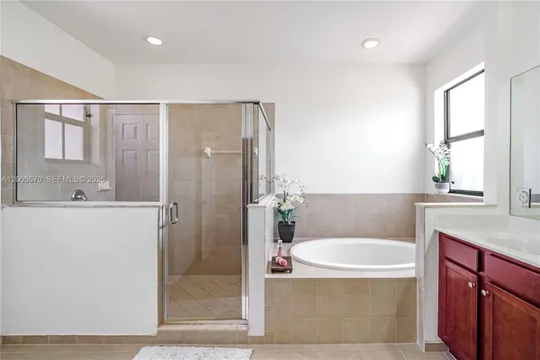 a bathroom with a sink and a window