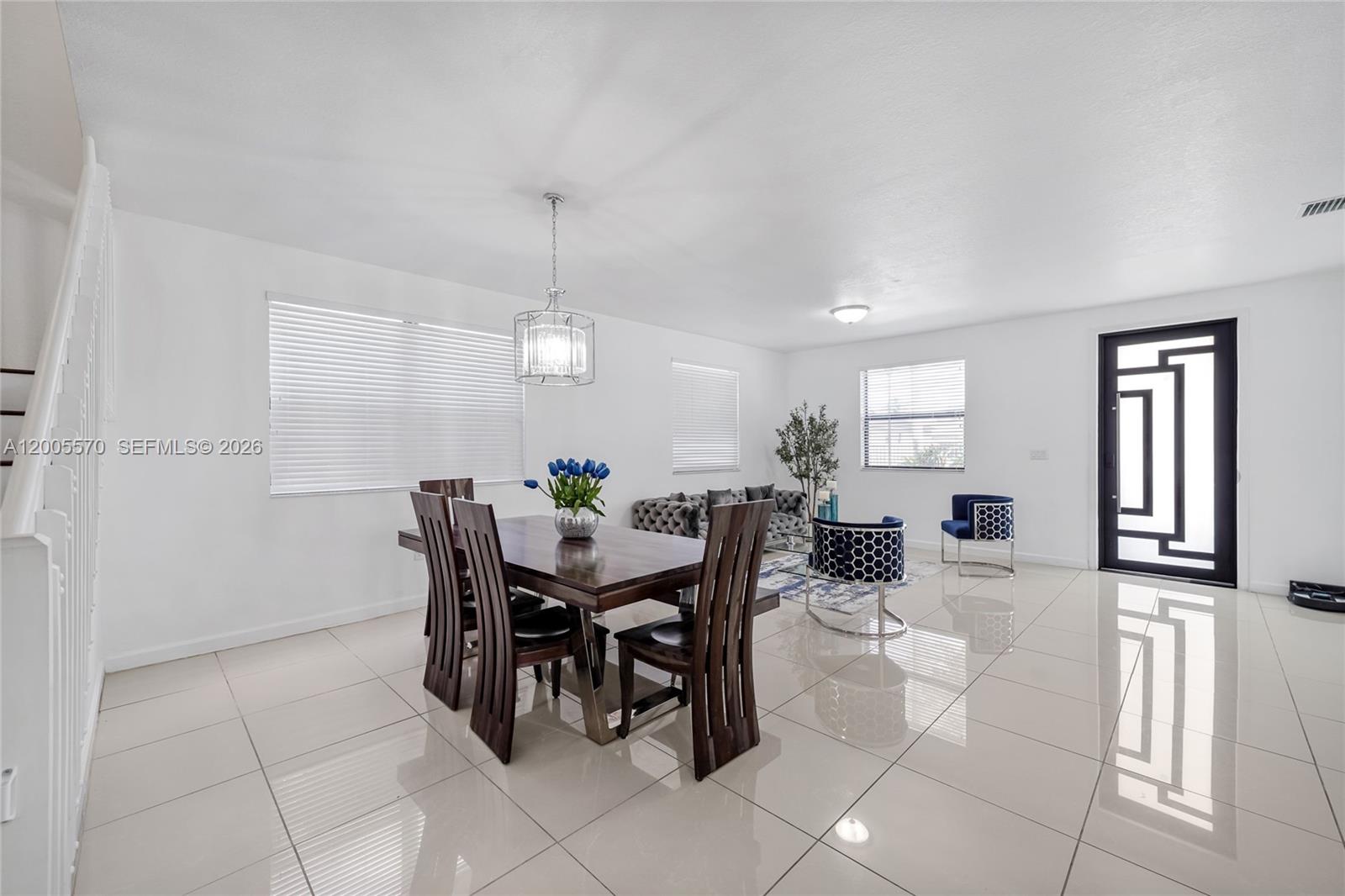 15294 Southwest 173rd Street Miami, FL 33187 - Photo 3 of 48 a view of a dining room with furniture