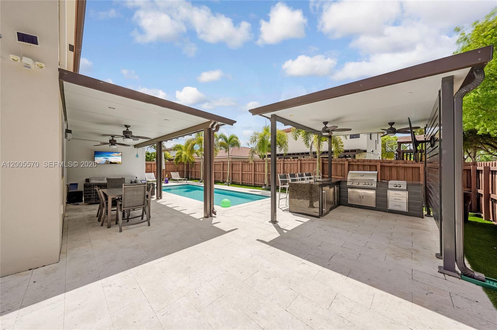 15294 Southwest 173rd Street Miami, FL 33187 - Photo 34 of 48 a view of a porch with furniture