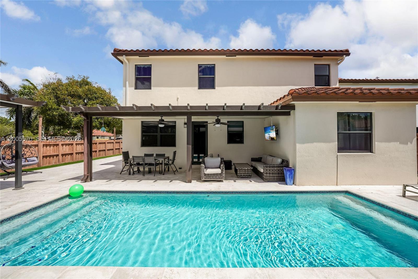 15294 Southwest 173rd Street Miami, FL 33187 - Photo 39 of 48 swimming pool view with a outdoor seating