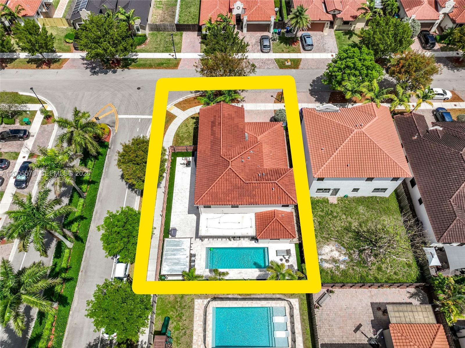 15294 Southwest 173rd Street Miami, FL 33187 - Photo 42 of 48 an aerial view of a swimming pool with outdoor seating and yard