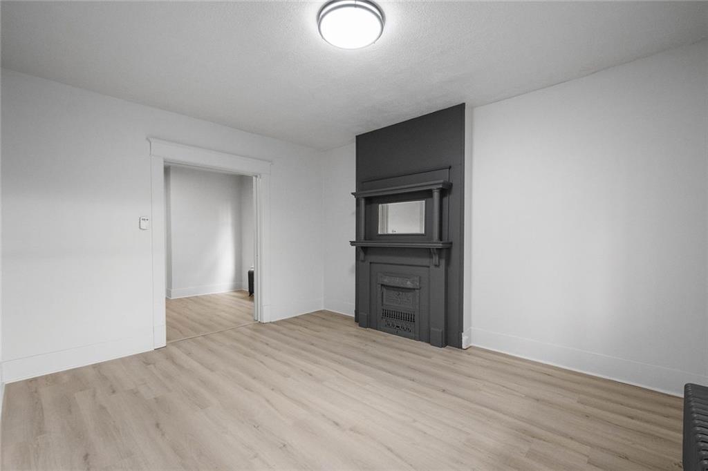 306 Park Road Ambridge, PA 15003 - Photo 4 of 43 a view of empty room with wooden floor