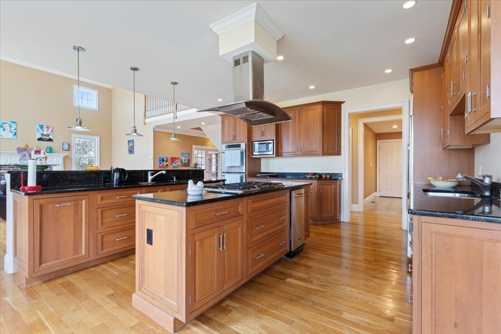 8 Middleby Road Lexington, MA 02421 - Photo 11 of 42 a kitchen with stainless steel appliances granite countertop a sink a stove and a refrigerator