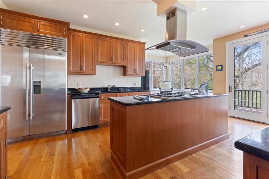 8 Middleby Road Lexington, MA 02421 - Photo 12 of 42 a kitchen with stainless steel appliances granite countertop a refrigerator a sink and a stove