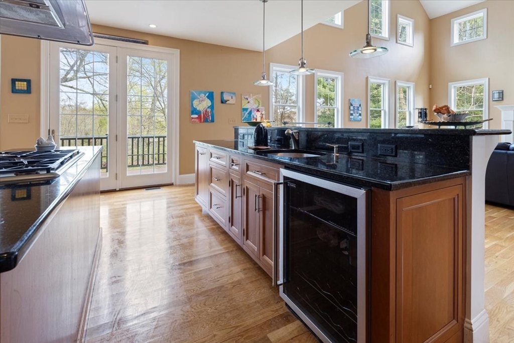 8 Middleby Road Lexington, MA 02421 - Photo 13 of 42 a kitchen with stainless steel appliances granite countertop a stove a sink and a refrigerator