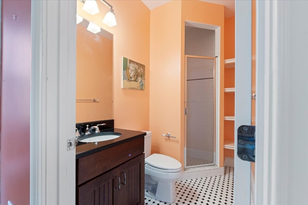 8 Middleby Road Lexington, MA 02421 - Photo 18 of 42 a bathroom with a toilet a sink and a shower