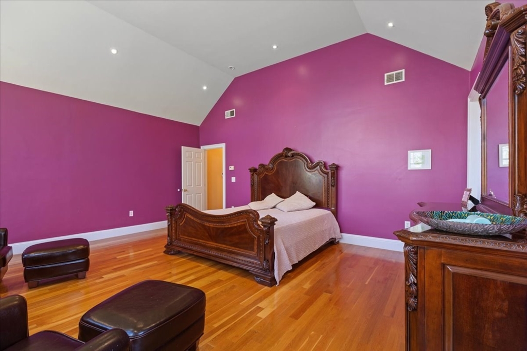 8 Middleby Road Lexington, MA 02421 - Photo 23 of 42 a bedroom with a bed and a dresser