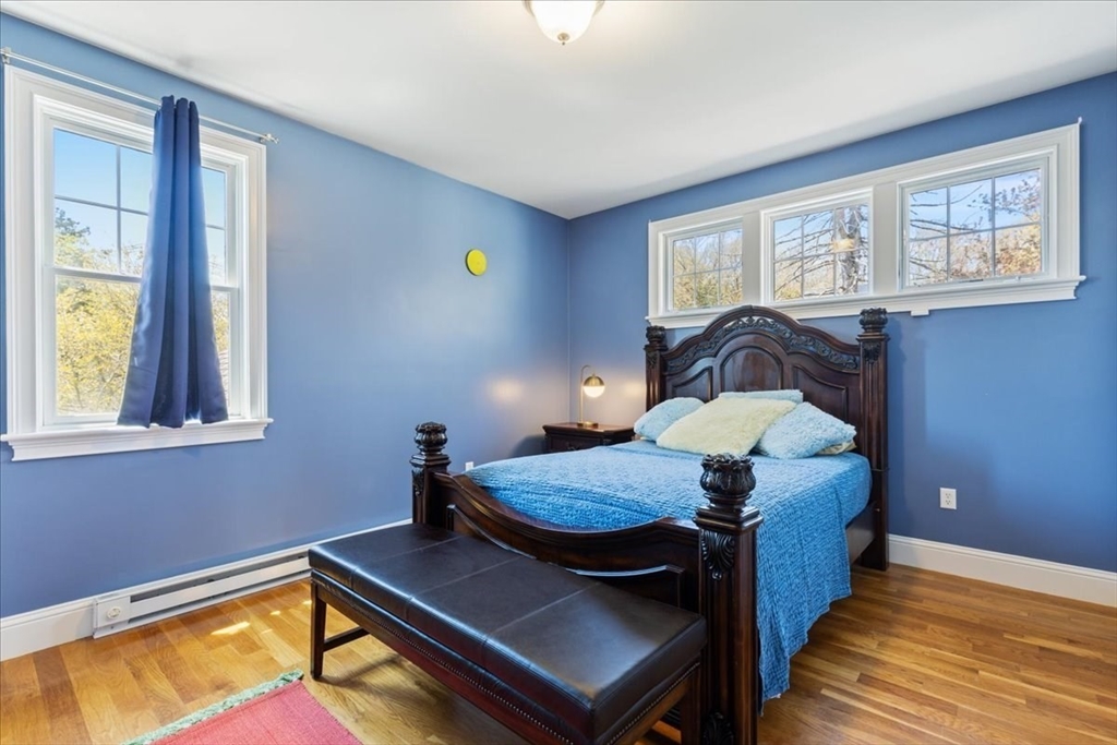 8 Middleby Road Lexington, MA 02421 - Photo 28 of 42 a living room with a bed furniture and a window