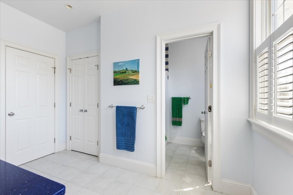 8 Middleby Road Lexington, MA 02421 - Photo 30 of 42 a view of a hallway with bathroom and wooden floor