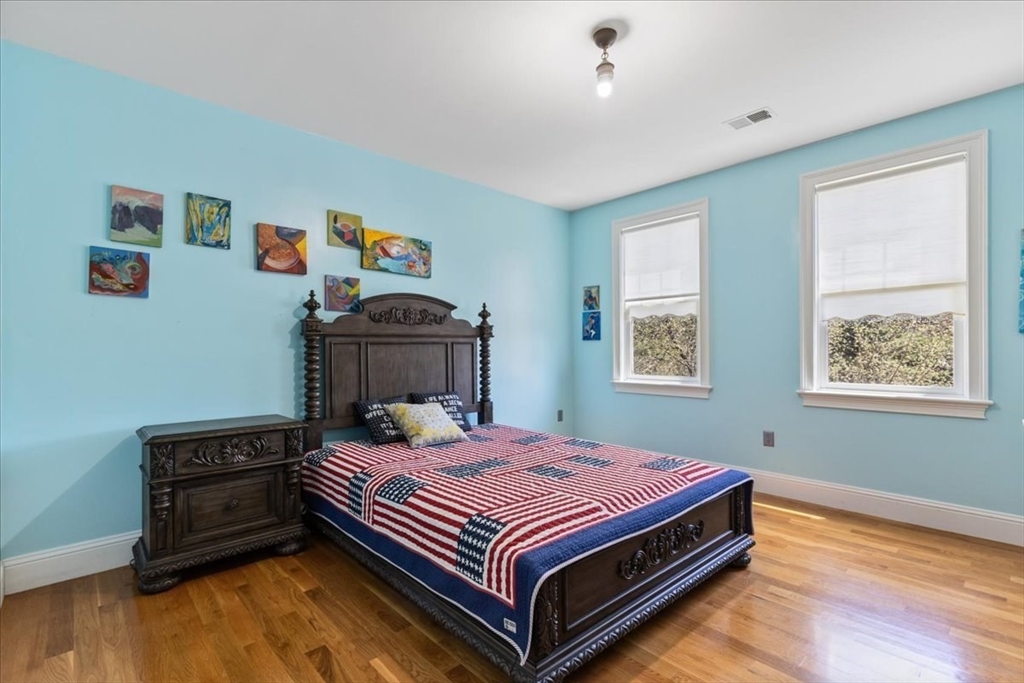 8 Middleby Road Lexington, MA 02421 - Photo 33 of 42 a bedroom with a bed and wooden floor